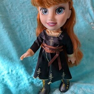 Charming Black and Brown Doll with Embroidered Dress